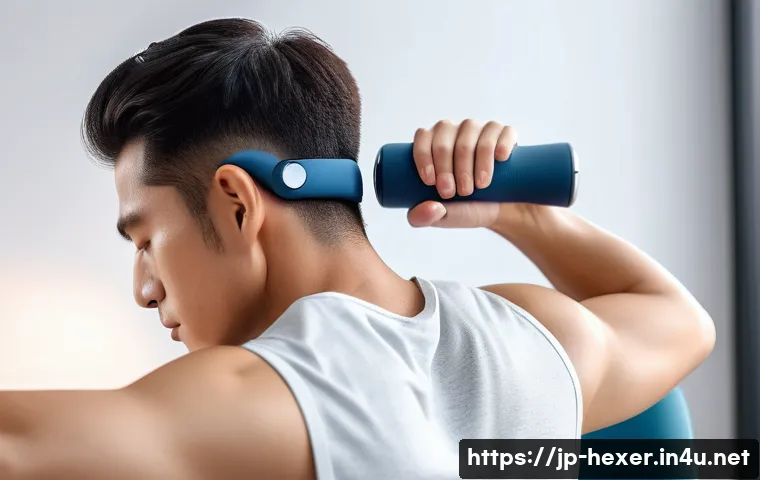 근육 회복을 돕는 마사지건 비교 - A modern, sleek massage gun in use on a person&rsquo;s shoulder, featuring a U-shaped attachment gently pr...